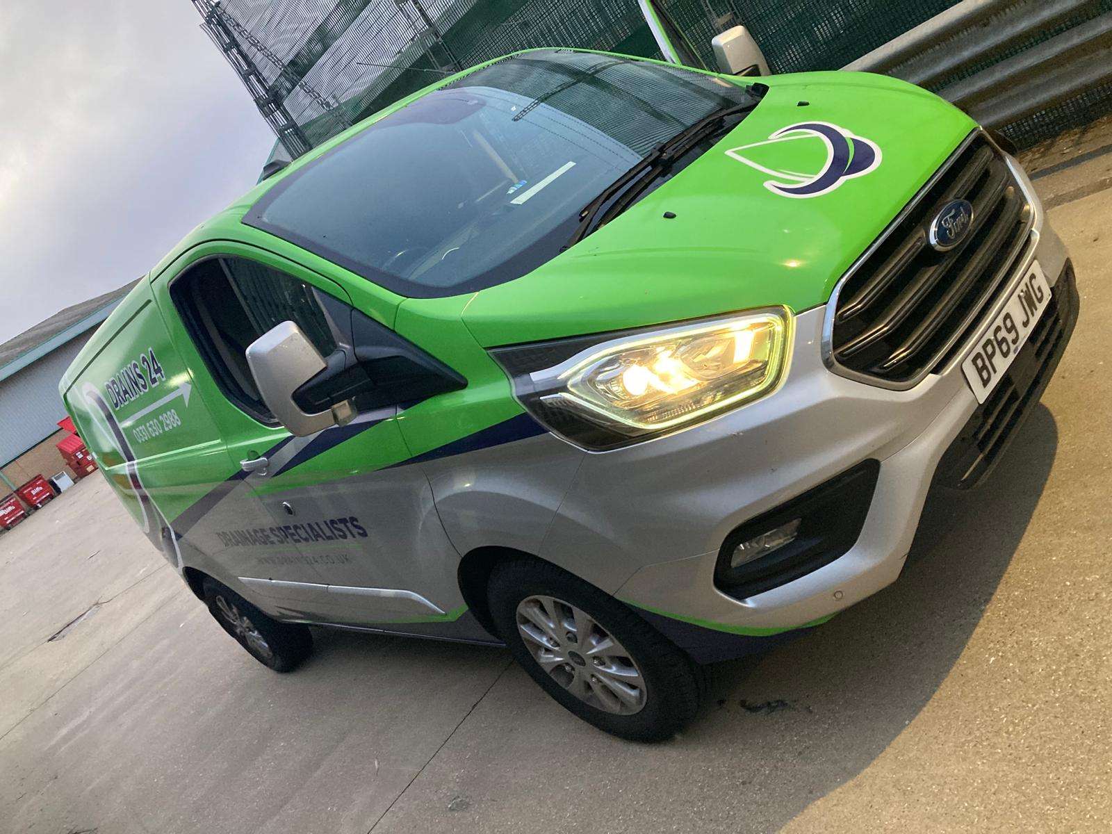 Salisbury Drains24 engineer inspecting commercial drainage system at a business premises